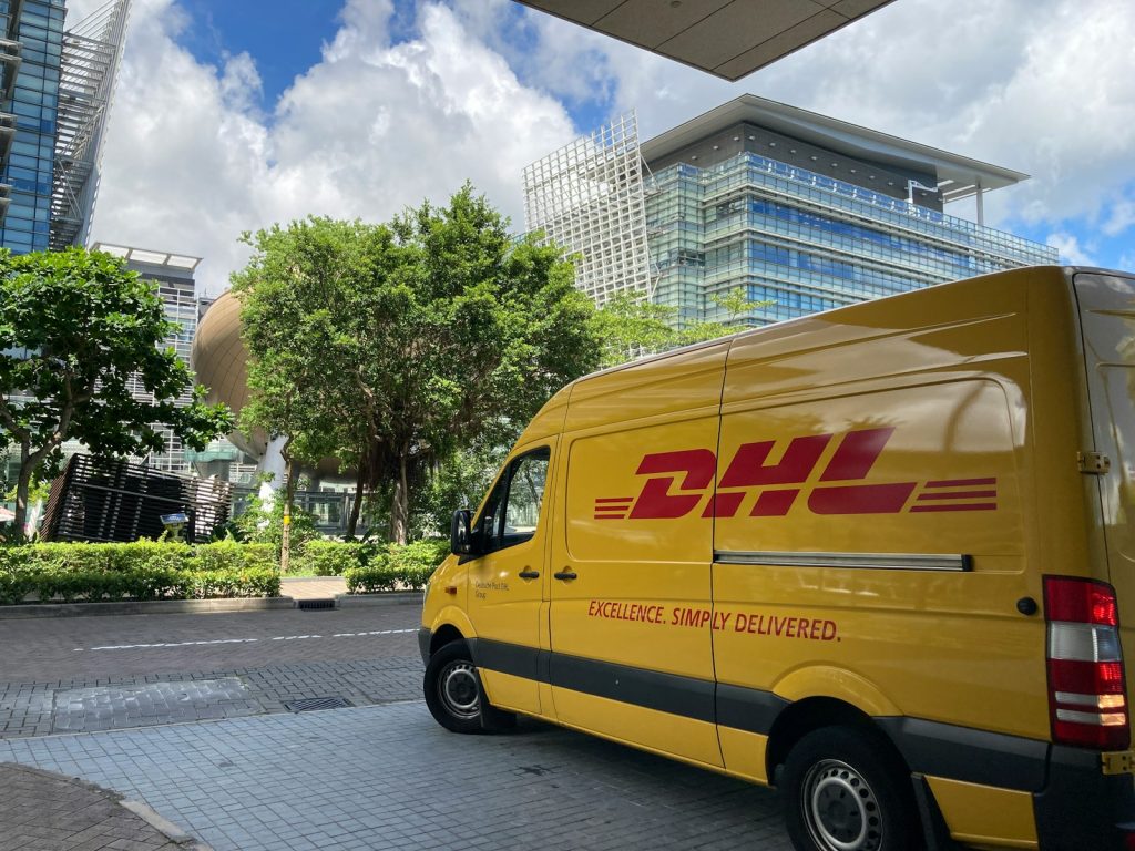 yellow van parked on sidewalk during daytime