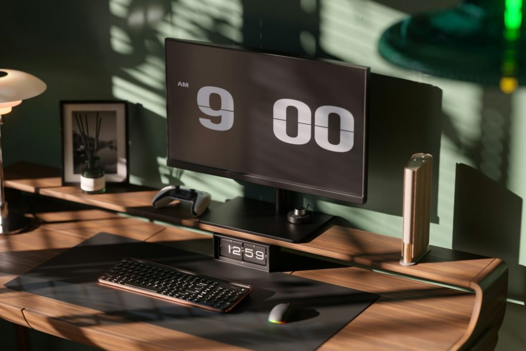 a desk with a monitor and keyboard on it