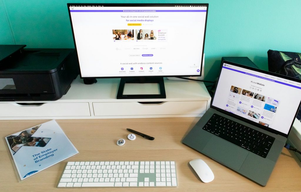 a laptop computer sitting on top of a wooden desk